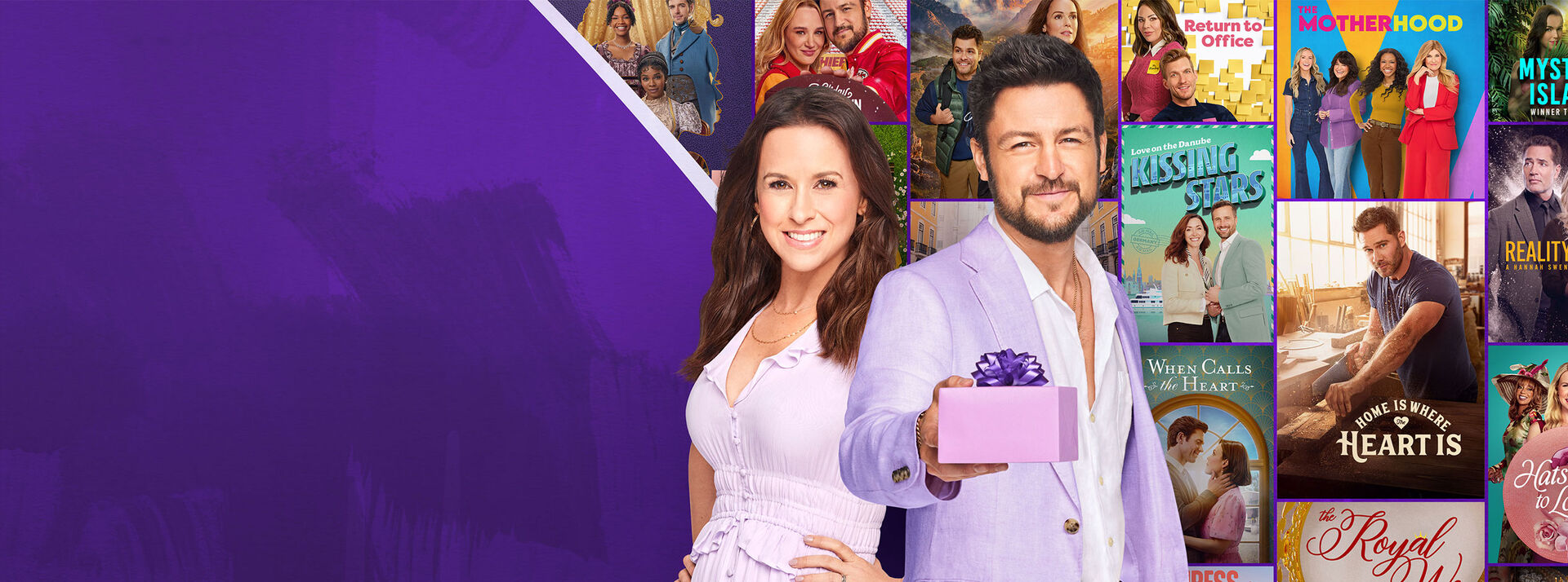 Brunette woman standing with a brunet man holding a purple wrapped gift.