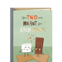 Card with smiling marshmallow and chocolate bar holding hands and You two are meant for each other'