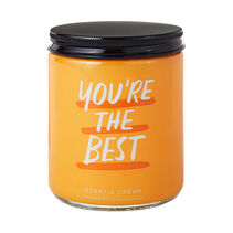 Orange lidded candle with You're the best' on the outside