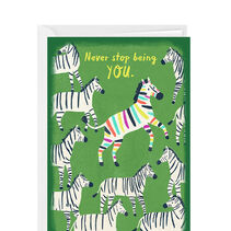 Green card with zebras on it and one zebra with rainbow stripes.
