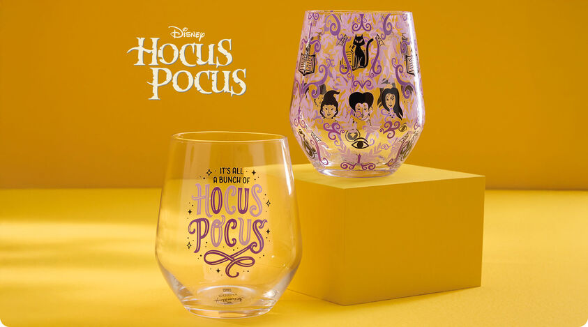 Stemless wine glasses with Hocus Pocus themed designs and phrases on them.