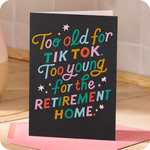 Black card with multicolor lettering that reads Too old for TikTok. Too young for the retirement home.'